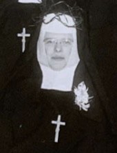 Headshot of a sister with a crown of thorns on her head.