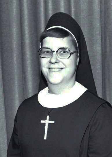 Headshot of middle-aged sister.